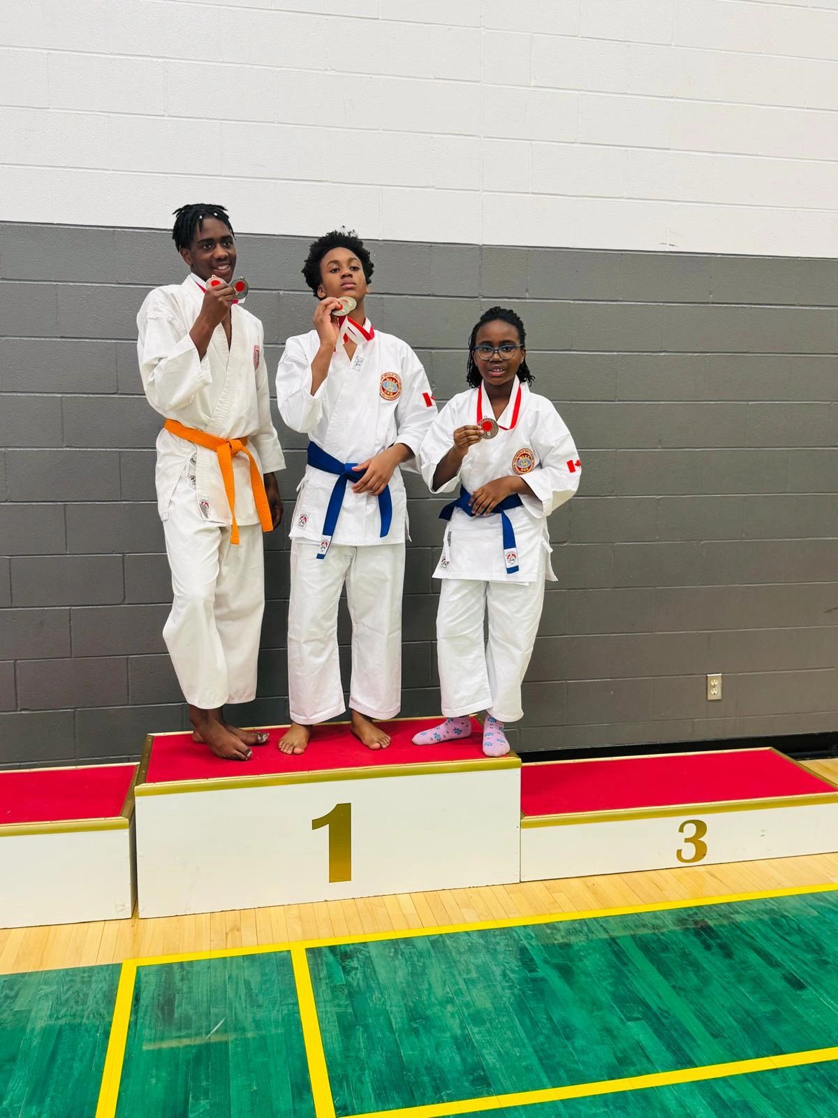 Young karate students on the winners' podium
